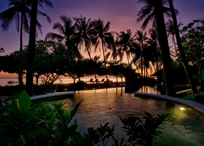 Twilight golden hour shoot at Vila Markisa, Tulamben, Bali — dramatic purple sky over villa